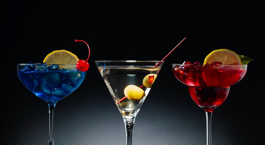 Two Colorful Cocktails And Dry Martini With Green Olives. Red An