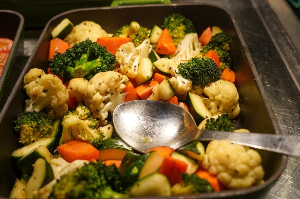 Baked Vegetables On Serving Tray With Spoon